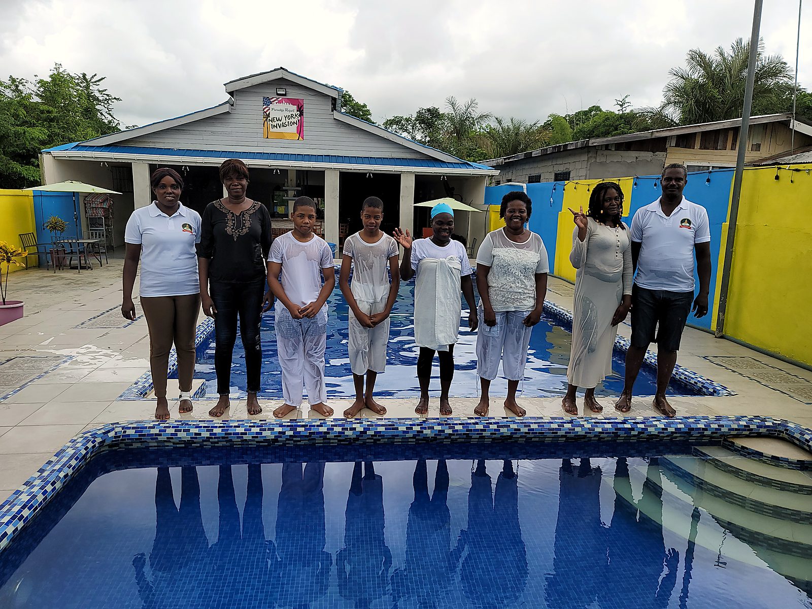 Baptism candidates standing by the pool