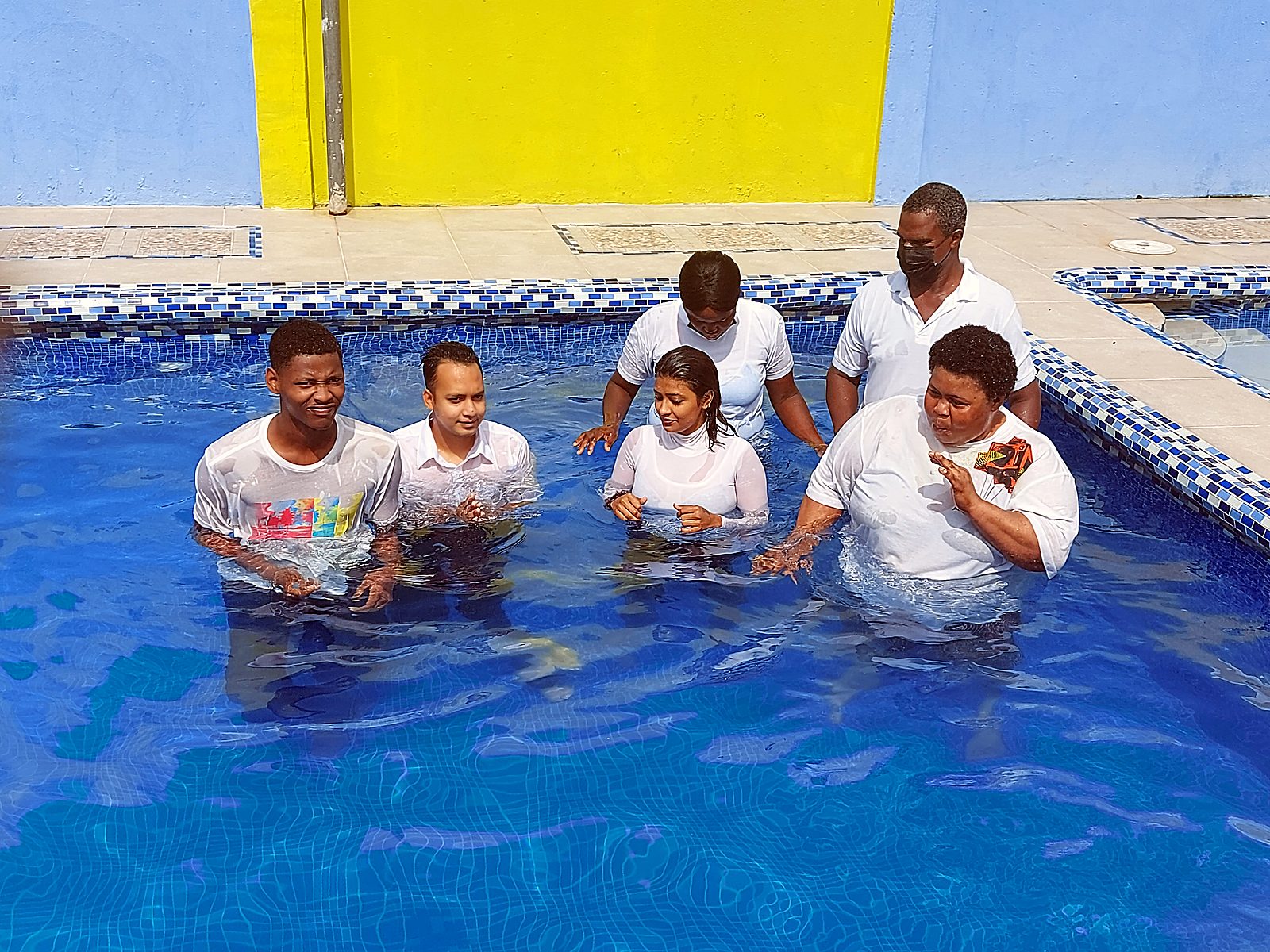Baptism candidates in the pool